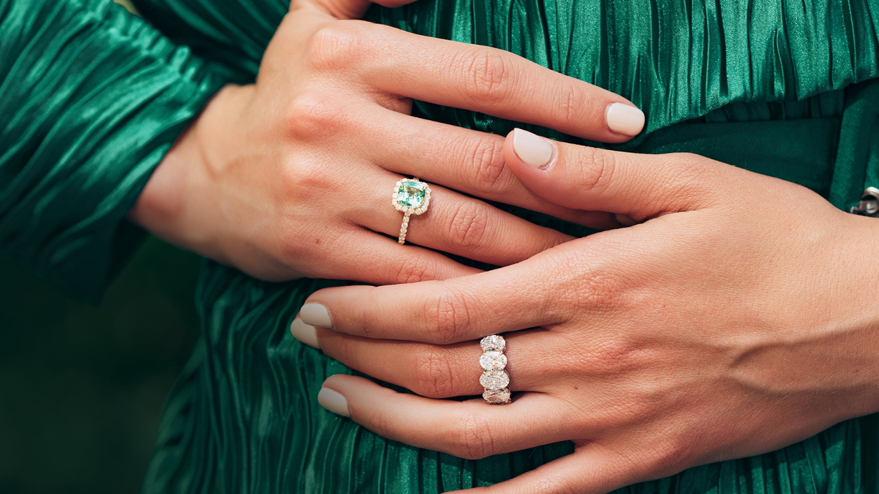 A tourmaline and diamond halo ring and a five-stone oval diamond ring.