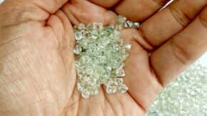 Small rough diamonds in hand credit Shutterstock 1280 used 022023